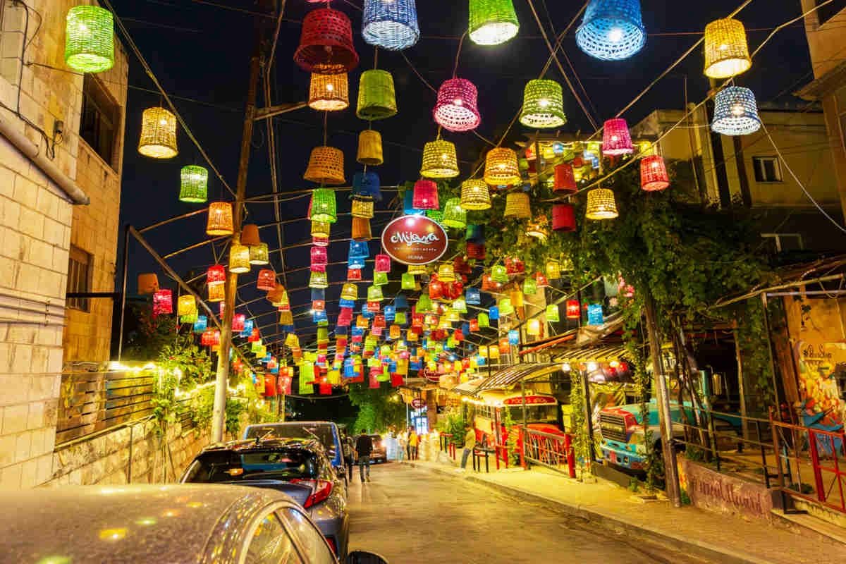 Lanterns strung above Rainbow Street at night